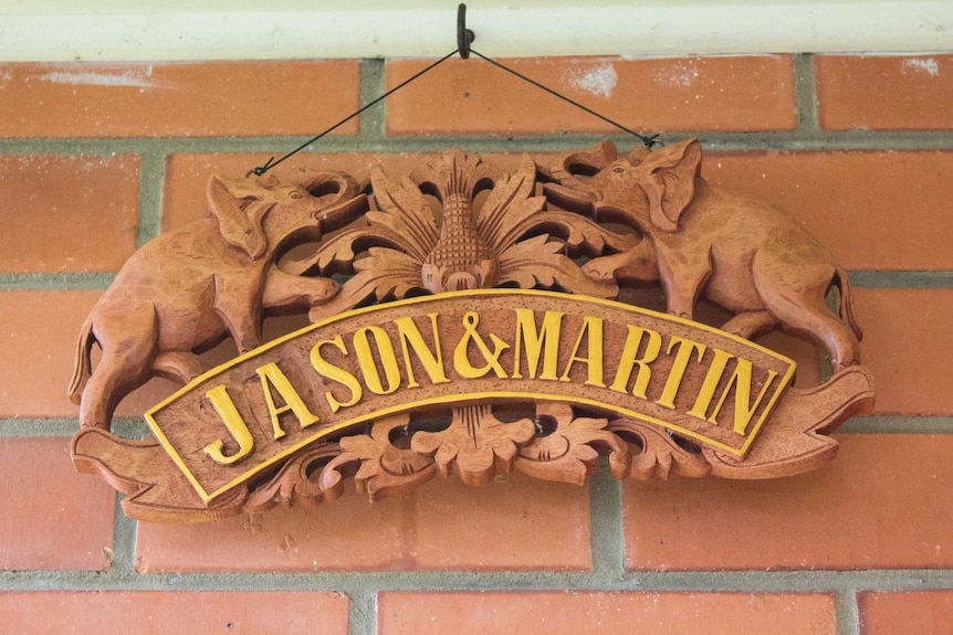 A handmade Indonesian welcome sign with Jason and Martin's names on it at their front door.