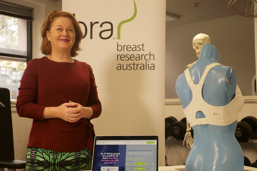 Associate Professor Deidre McGhee standing in front of a laptop. 