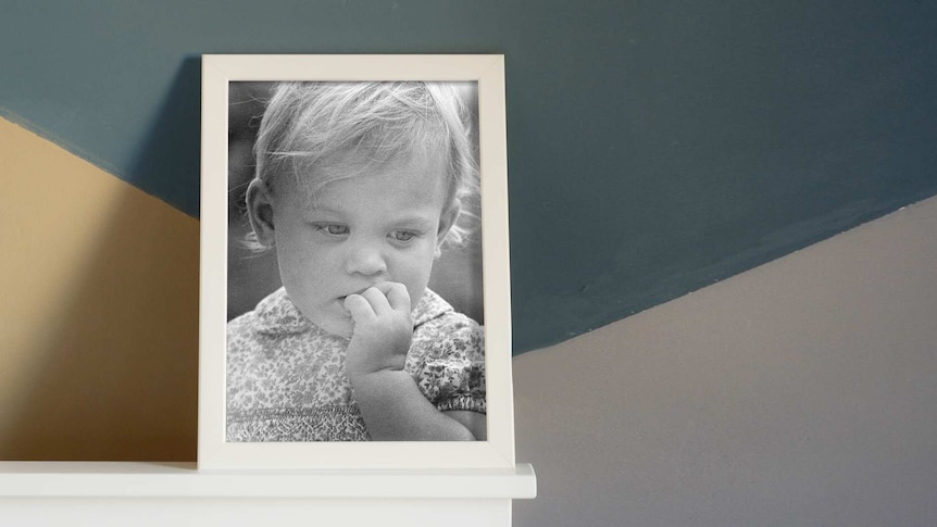 Black and white photo of a young girl in a photo frame for a story about an adoptee tracing down her birth mother.
