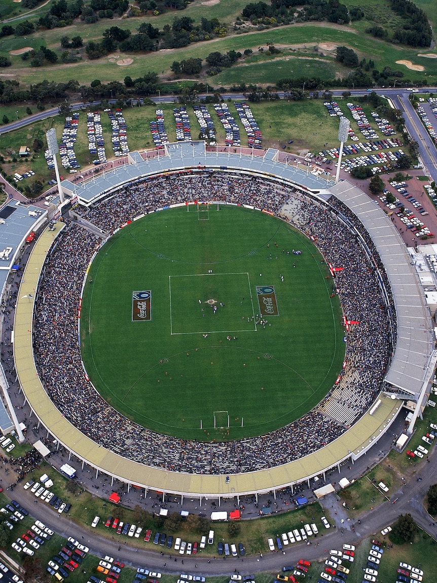 A picture looking down on an oval stadium, with a football pitch in the middle.