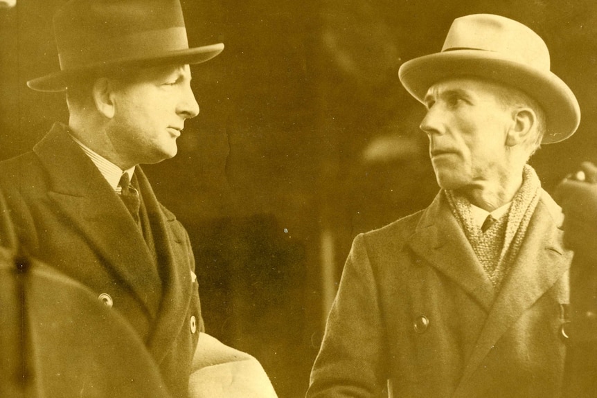 A black and white photograph of Bernard Heinze with WJ Cleary, both wearing hats and coats.