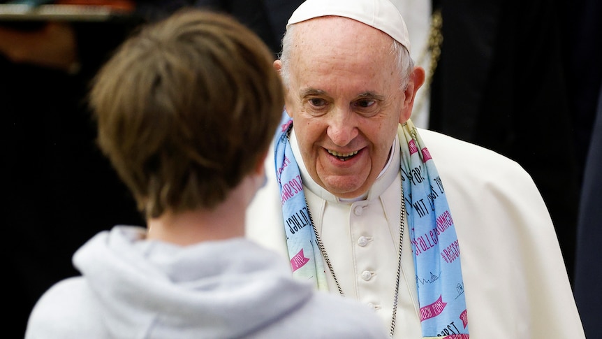 Pope Francis greets a young person
