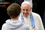 Pope Francis greets a young person