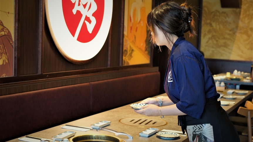 An unidentified woman working at a Sunnybank restaurant.