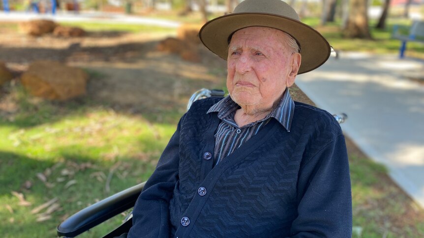 World War II veteran Arthur Leggett sitting on a chair looking into the distance