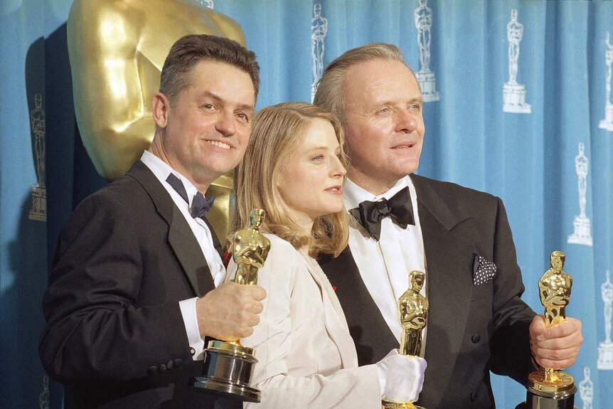 Silence of the Lambs director, Jonathan Demme with the movie's stars, Jodie Foster and Anthony Hopkins at the Oscars.