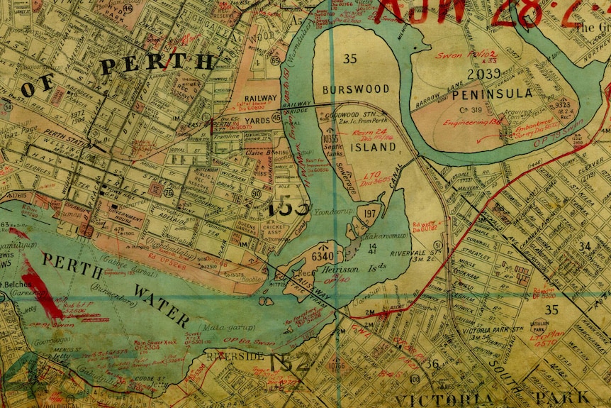 An old map showing streets and suburbs of Perth, a snaking river and its islands.