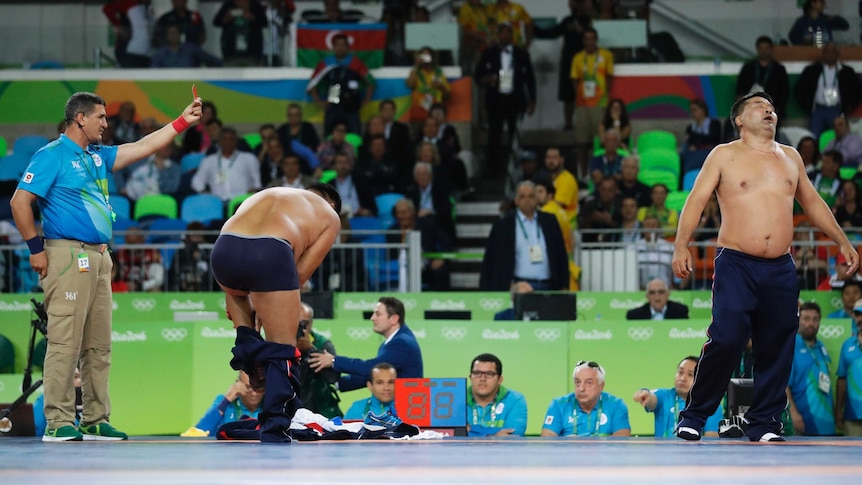 Mongolians protest wrestling disqualification by removing clothes