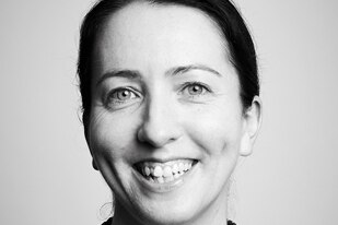 Black and white portrait of Dr Rachael Nolan smiling