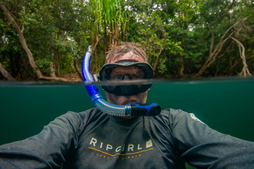 Selfie of photographer Gary Cranitch in the water wearing mask and snorkel