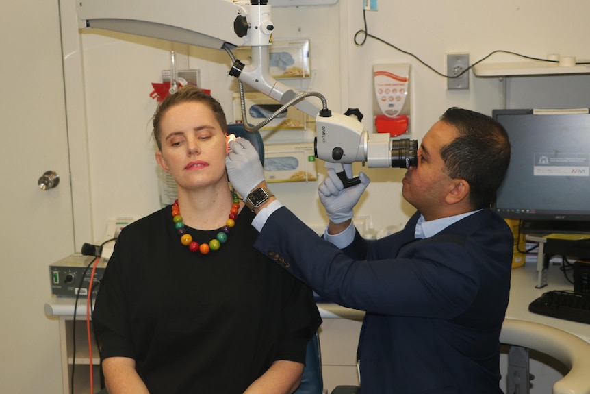 Dr Jaffri Kuthubutheen examines Hannah's auditory canal