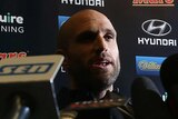 Curtain drawn ... Chris Judd speaks to the media at Princes Park after announcing his retirement