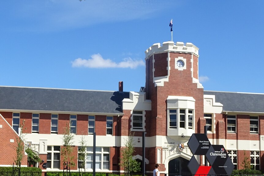 Front entrance of a high school on a sunny day