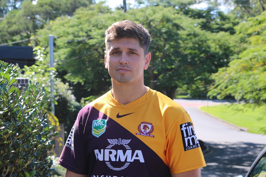 Kieren Johston poses in a Brisbane Broncos jersey.