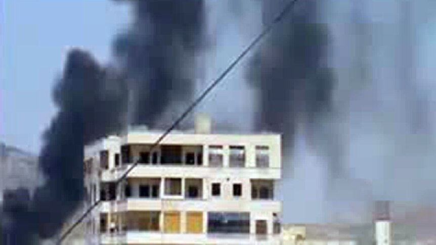Smoke rises from buildings in Hama, Syria