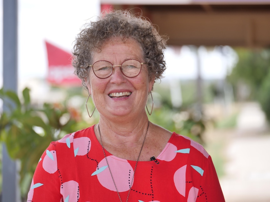 Lesley Bryce in her red top outside of the bell Cares office