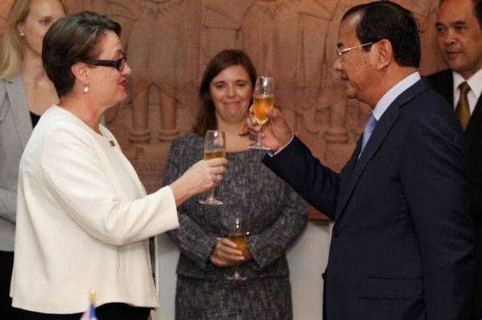 Australian Ambassador toasts champagne with the Cambodian government