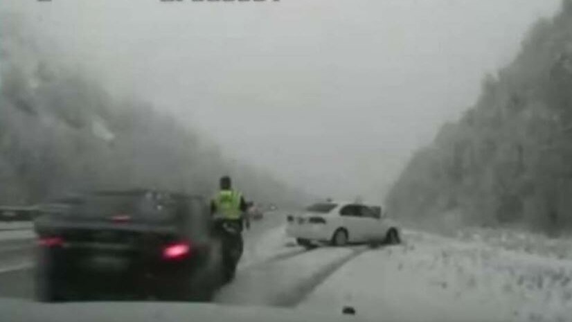A screenshot from the dashcam footage shows the moment of impact.