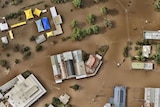 aerial view of several homes and buildings under water