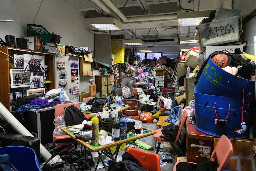 Scattered clothes, protective gear and other objects are seen in a room in the Hong Kong Polytechnic University.