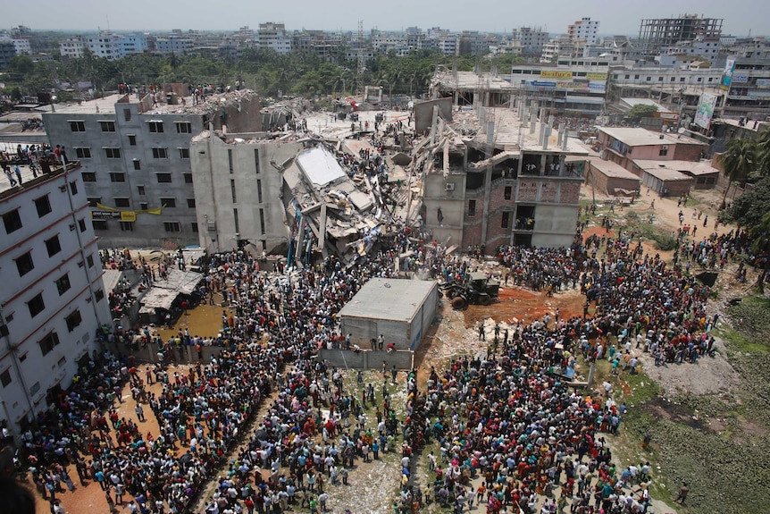 Crowds gathering at Rana Plaza building as people rescue garment workers trapped inside, on April 24, 2013.
