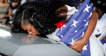 Pregnant widow Myeshia Johnson kisses the casket holding her fallen solider husband, La David Johnson.