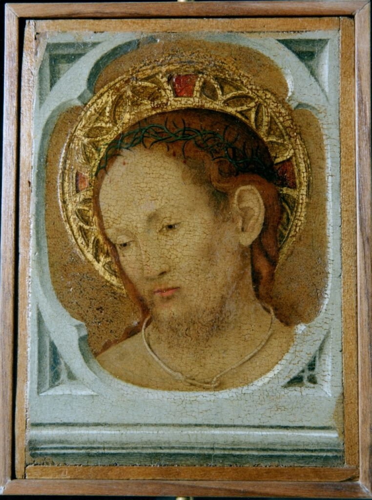 A renaissance painting of a mans head with an interpretation of a halo around it