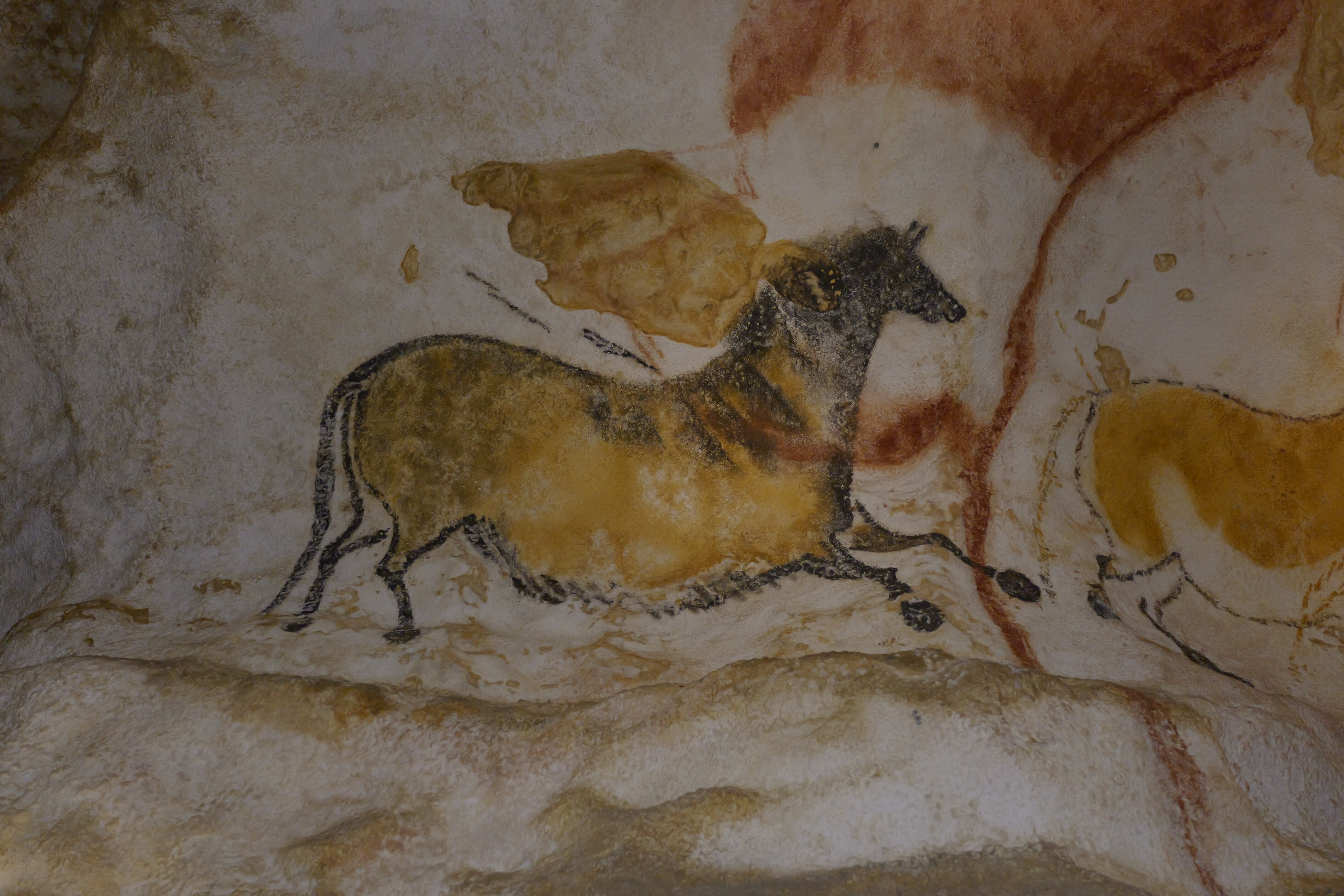 pintura de animal pré-histórico em uma caverna