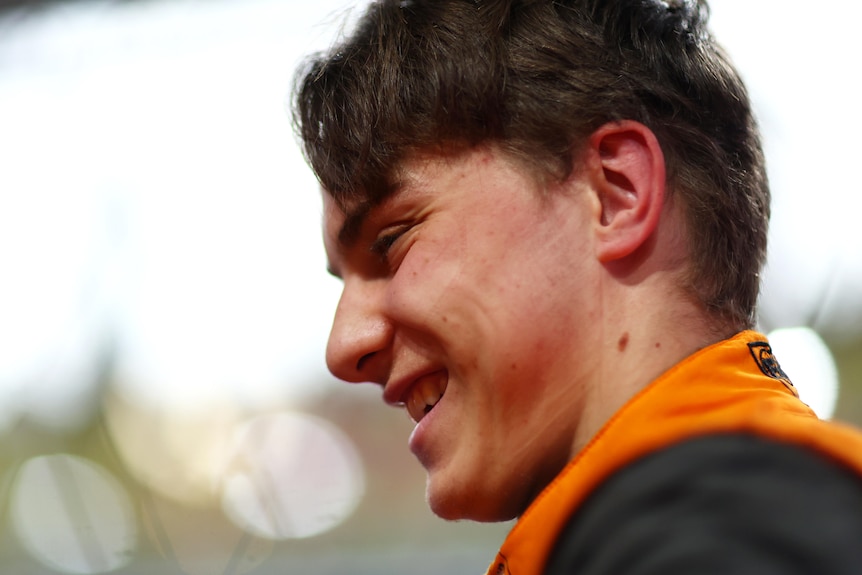 A racing driver smiles before the start of the Saudi Arabian Grand Prix