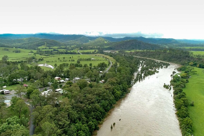 Small town beside very swollen river