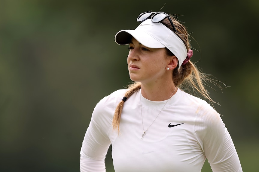 An Australian golfer looks to side of frame during a round of a major championship.