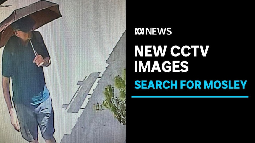 New CCTV Images, Search for Mosley: CCTV image of a man walking, holding an umbrella.
