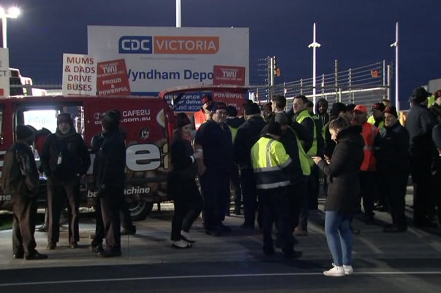 Striking bus drivers standing outside the CDC Victoria depot at Wyndham.