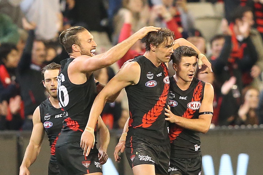 Joe Daniher (2R) after scoring a goal for Essendon against Geelong at the MCG on May 13, 2017.