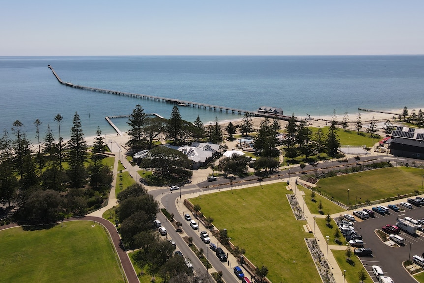 An aerial view of Busselton foreshore, with the ocean, sand and grass visible.