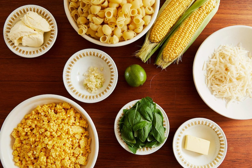 Corn kernels, double cream, garlic, lime, basil, shell pasta, parmesan and butter combine to make a creamy corn pasta dinner.