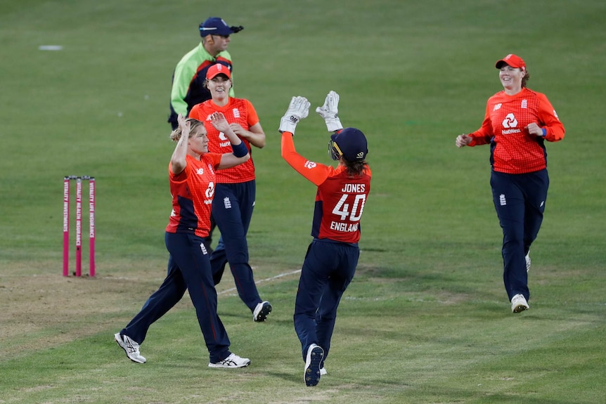 The bowler and wicketkeeper run in to exchange high-five after a wicket in the Women's Ashes.