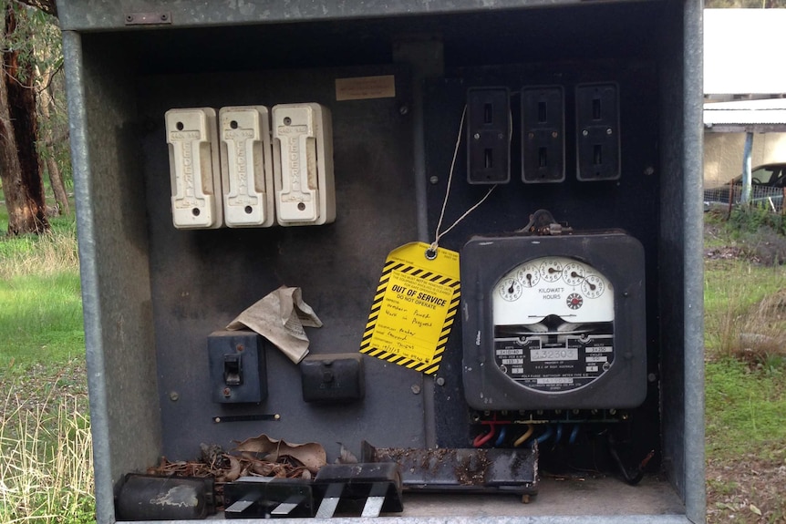 A 2013 photo of the meter box on the power pole in question, with an out of order sign on it.