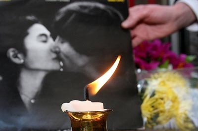 Tributes to John Lennon, 25 years after his death, are laid outside the Cavern Club in Liverpool.