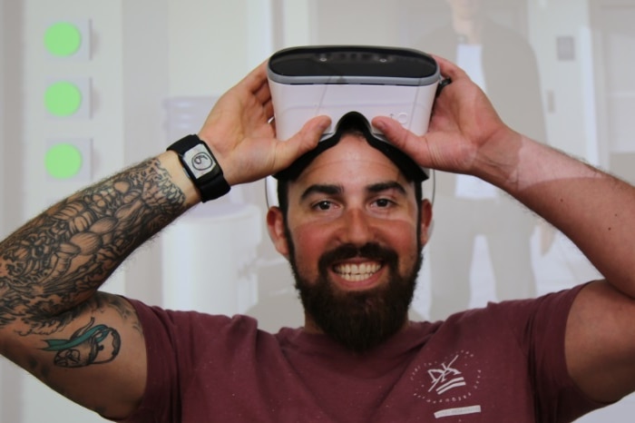Matt Stern wearing the virtual reality goggles to undertake the Angry Stan training program
