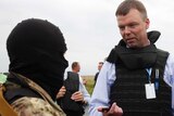 OSCE monitors speak with separatists at MH17 crash site