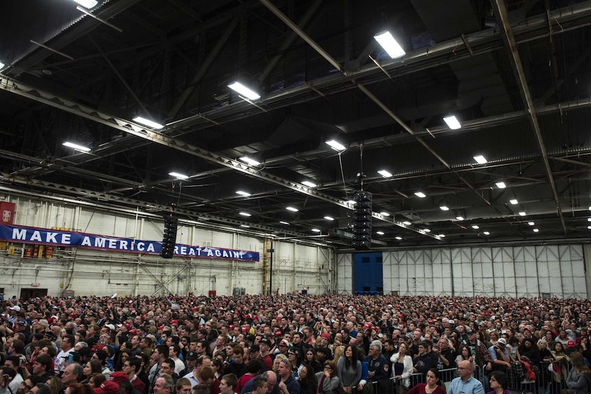 A large crowd is gathered as Donald Trump gets ready to hold a campaign rally.