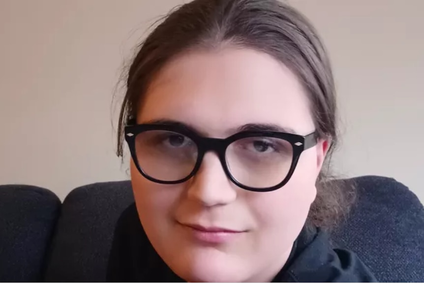 A young woman with black-rimmed glasses 