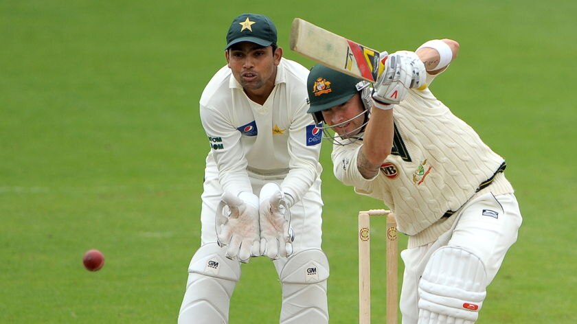Vice-captain's knock...Michael Clarke hits out as Kamran Akmal watches from behind the stumps.