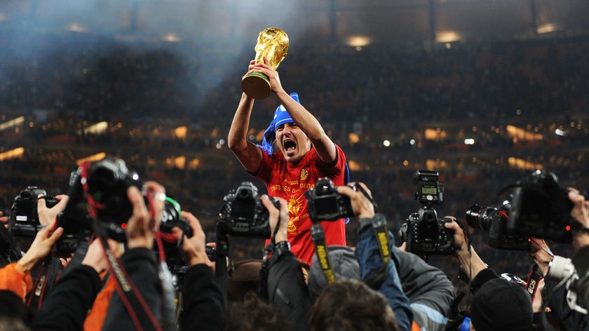 Viva Espana: David Villa hoists the World Cup trophy after a wonderful tournament in which he scored five goals.