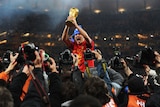 Viva Espana: David Villa hoists the World Cup trophy after a wonderful tournament in which he scored five goals.