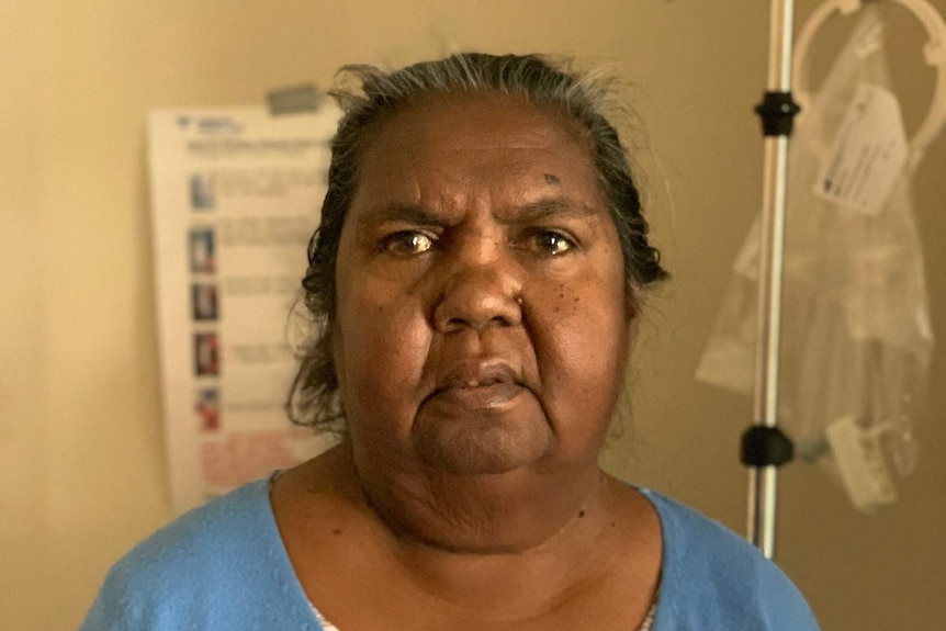 Leah Dolby sits in front of a dialysis machine.