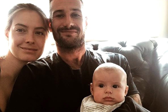Chris Masten with his wife Emmi and their baby boy.