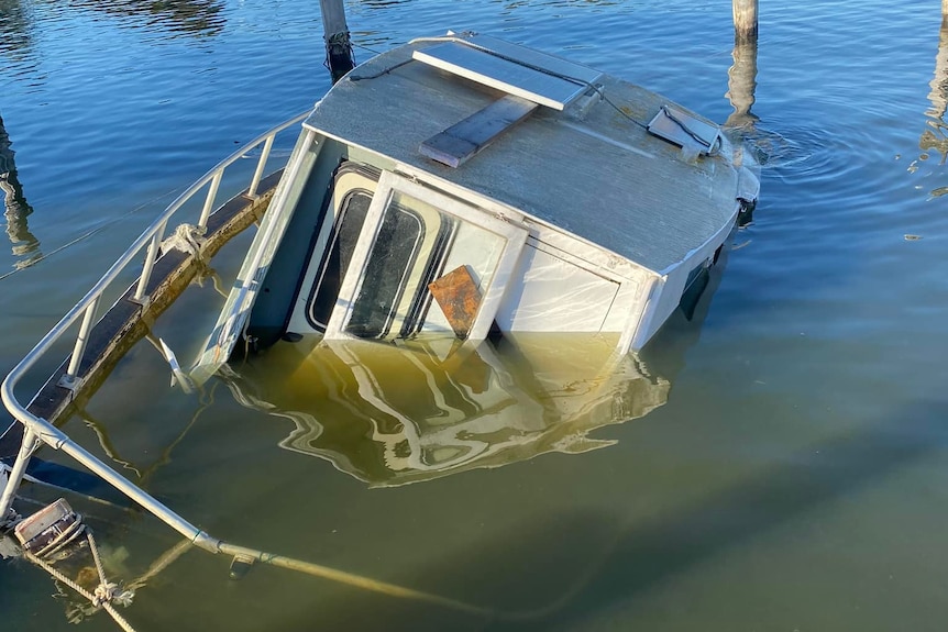 A semi-sunken boat.