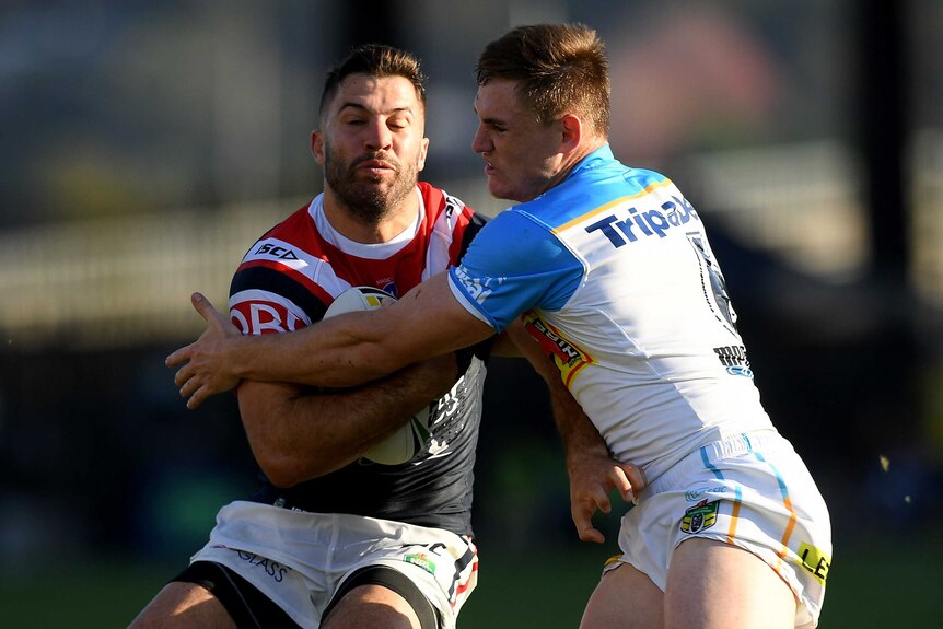 James Tedesco is tackled by AJ Brimson.